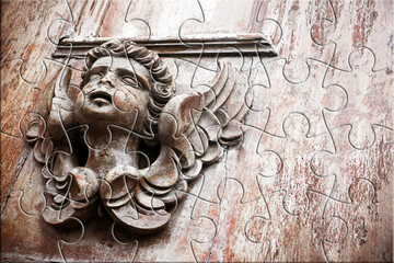 Fototapeta premium SCULPTURE OF AN ANGEL ON A WOODEN DOOR - The slow faith building or loss - Faith building or loss concept in jigsaw puzzle shape