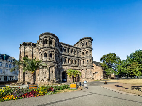 Trier, Germany, Europe - July 25, 2026: East side of the Porta Nigra, large Roman city gate, under blue sky