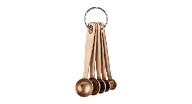 Set of copper measuring spoons on a ring for accurate kitchen ingredient measurement