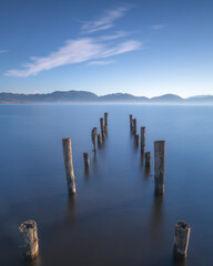 Fototapeta premium Old Wooden Pier Remains Massaciuccoli Lake Long Exposure