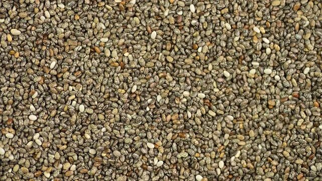 Chia seeds close-up, top view, rotating 