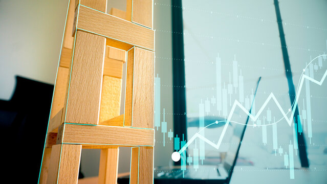Analyzing Real estate investment growth and property market financial chart. with candlestick display and wooden blocks.