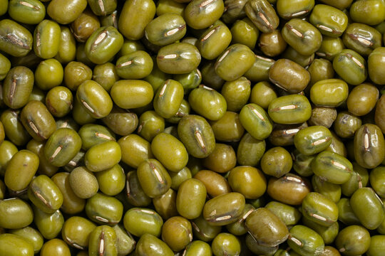 Raw organic green mung bean texture background.