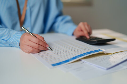 Auditor conducting a meticulous examination of corporate balance sheets and financial statements at office, certified public accountant services, corporate tax compliance, internal financial control
