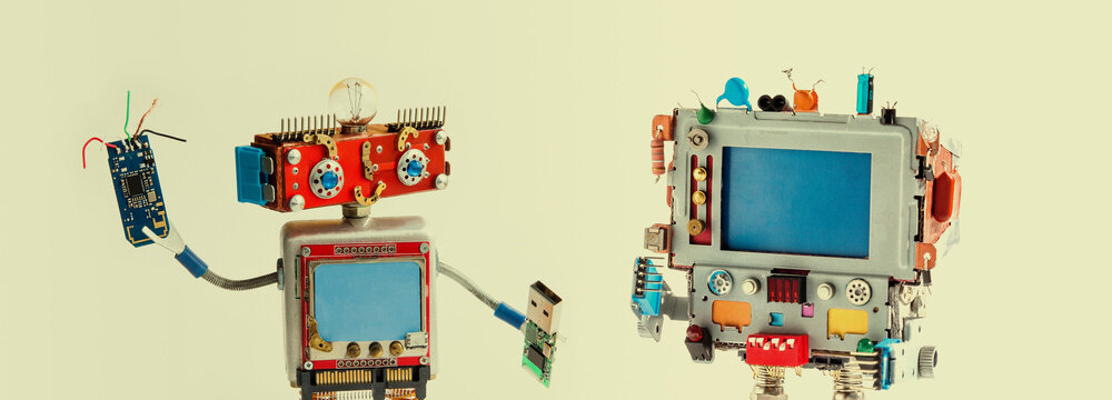 Retro computer with empty blue screen, IT specialist robot with smiley red head, chip and usb flash stick, robotic maintenance repair fix concept, beige background