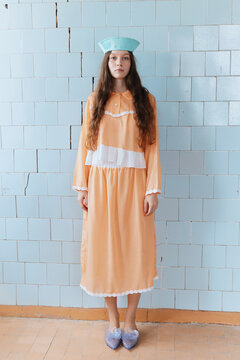 Fashion Portrait Woman in Vintage Peach Dress Indoors