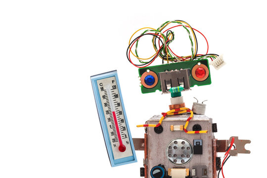 Close-up of funny kind toy robot weather forecaster with blue and red eyes, wire hair, holding large thermometer for measuring ambient temperature