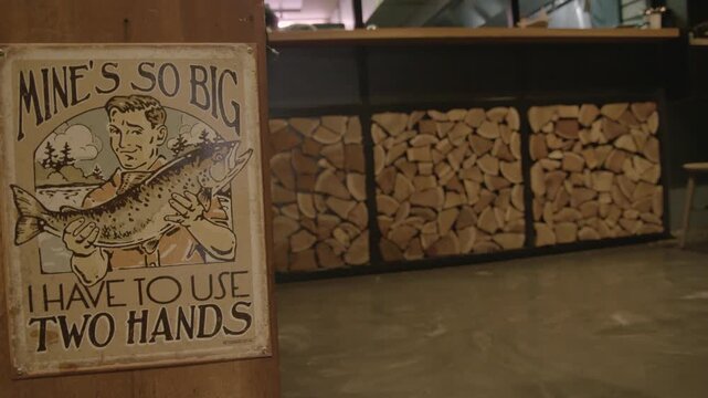 Vintage Fish Sign and Stacked Firewood in Rustic Sydney Restaurant