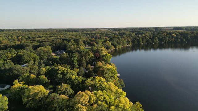Aerial over Lake Chapin, along the St. Joseph's River. Berrien Springs, Oronoko Charter Township, Michigan, United States. Rural farms and lakeside / riverside home and vacation properties. Rising up.