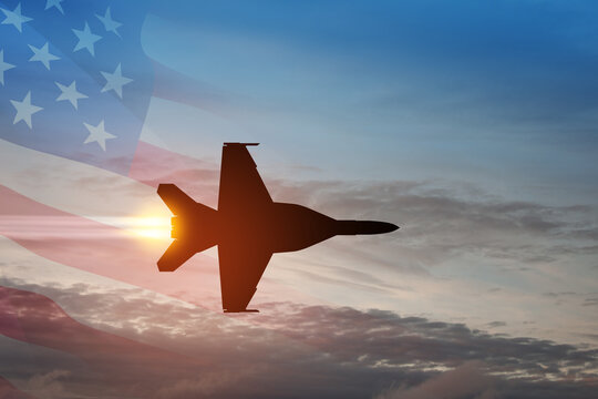 Air Force Day. Aircraft silhouette on background of sunset with a transparent American flag.