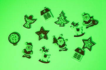 Fototapeta premium Christmas wooden ornaments creating festive green holiday display
