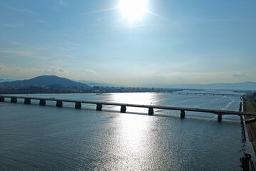 Fototapeta premium Aerial drone photo of bridge and river with cityscape in Tokushima, Japan