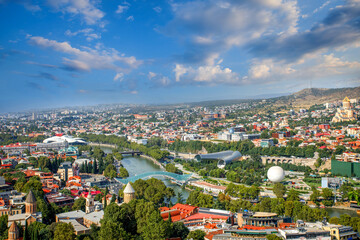 Tbilisi skyline aerial view. Kura river, Bridge of Peace and old town of Tbilisi cityscape, Georgia © artmim