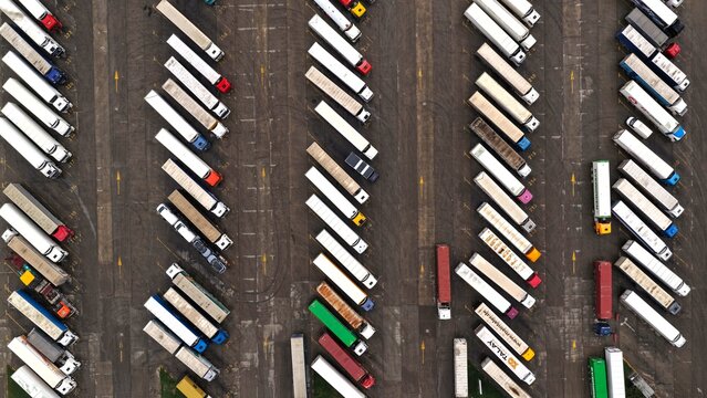 Aerial view of numerous semi-truck trailers parked in organized rows at a logistics facility in Tbilisi, Tbilisi, Georgia.