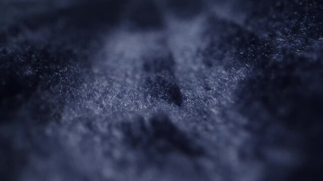 Close-up detail of a soft blue blanket or towel showing fluffy fabric texture. Concept of comfort, coziness, home textiles and softness.