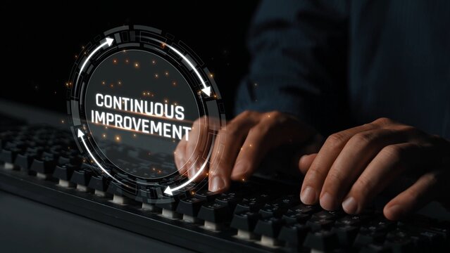 Hands Typing on Keyboard with Focus on Concept of Continuous Improvement Highlighted by Graphic Elements and Digital Effects Sigmoid
