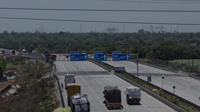 Aerial Drone Shot of Expressway NH4 Traffic Beside Industrial Building
