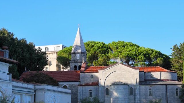 A video featuring St. James&rsquo; Church (Church of St. James) in central Opatija, Croatia, with its distinctive stone clock tower and pointed spire