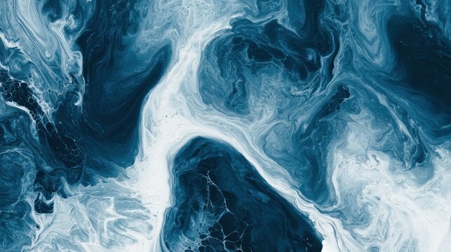 Overhead view shows prussian blue fluid mixed with milk, creating a dramatic contrast of very dark blue and white, resembling ocean depths.