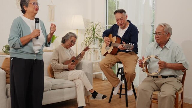 Senior retirement lifestyle elderly group enjoying music with guitar ukulele tambourine and microphone in bright living room cheerful home performance and social gathering