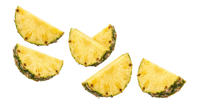 Fresh vibrant yellow pineapple slices arranged in a group showing juicy texture on transparent background