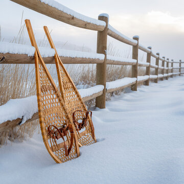 classic wooden Huron snowshoes in winter scenery at foothills of Rocky Mountains in northern Colorado - Lory State Park