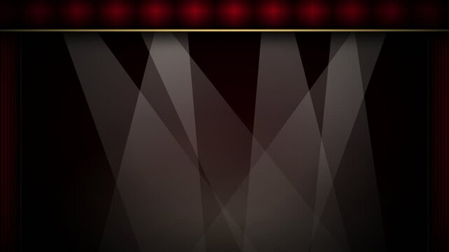 Red velvet theater curtain opening on stage with spotlights
