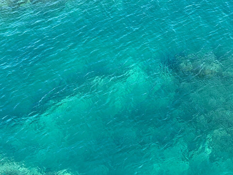 Azure blue clear sea water background 