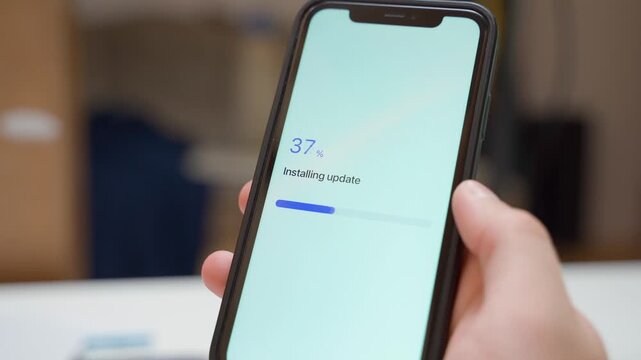 Software update installing on smartphone from zero to completed. Update installed confirmation screen with green progress bar