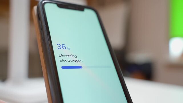 Blood oxygen measurement on smartphone screen with normal result. Health app showing oxygen saturation level close-up