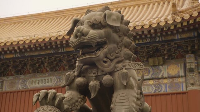 Stone Guardian Lion Statue at Ornate Temple Entrance in Beijing China