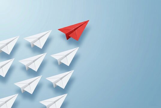 Red paper airplane leading white planes on blue background leadership concept