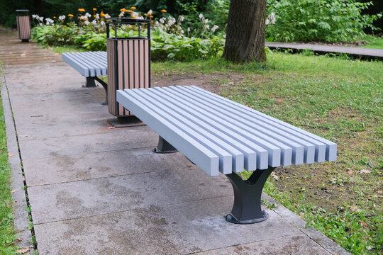 Empty blue wooden bench in the park