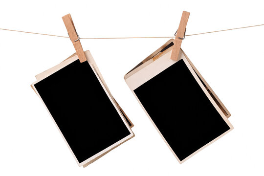 Pair of Blank Instant Photo Frames Hanging from a String with Wooden Clothespins