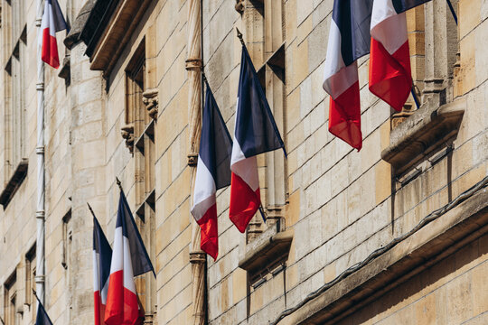 French tricolor flags displayed on the facade of the Libourne town hall in Libourne, France, on July 14, 2026