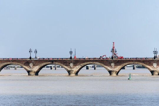 Historic Pont de Pierre bridge over the Garonne River undergoing renovation works, Bordeaux, France