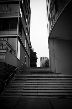 Urban architecture with contrasting modern buildings and ascending stairs