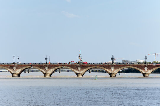 Historic Pont de Pierre bridge over the Garonne River undergoing renovation works, Bordeaux, France