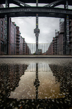 Speicherstadt warehouse bridge reflecting urban architecture in Hamburg