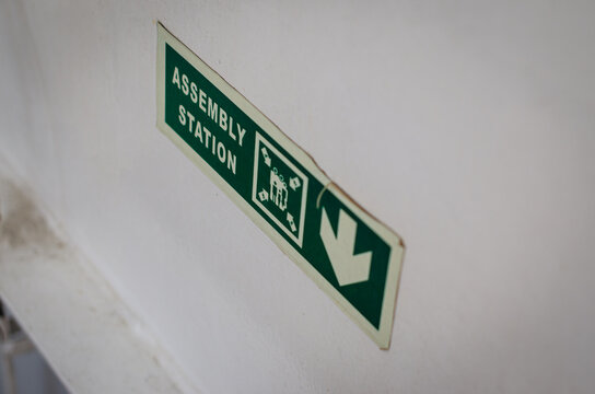 Assembly Station (Muster Station) sign on board an offshore support vessel, indicating the designated location where crew and personnel must gather during an emergency or safety drill