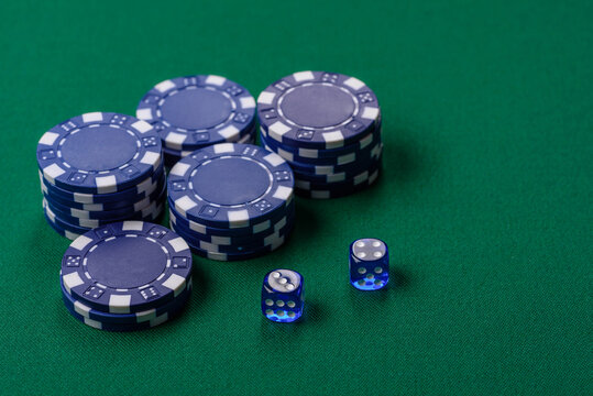 Multicolored casino chips as a conceptual backdrop for gambling games like poker, blackjack