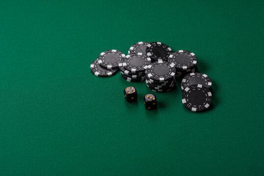 Multicolored casino chips as a conceptual backdrop for gambling games like poker, blackjack