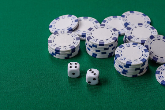 Multicolored casino chips as a conceptual backdrop for gambling games like poker, blackjack