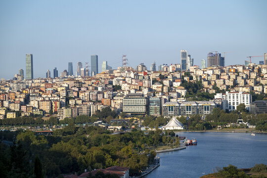 View of the Istanbul skyline with dense urban architecture, modern skyscrapers, and historic buildings overlooking the Golden Horn waterway in Istanbul, Istanbul, Turkiye.