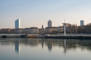 Obraz premium Lyon cityscape with modern skyscrapers and historic buildings reflected in the Sona river