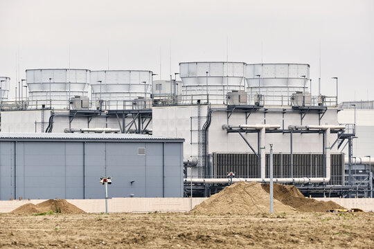 Taulov, Denmark - 28 August 2026: View of the Google Datacenter site featuring large industrial heat exchange units and cooling towers under an overcast sky.