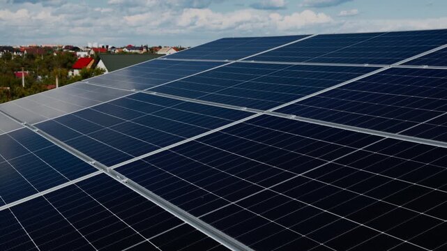 Rooftop solar panels near residential buildings demonstrate practical clean energy generation