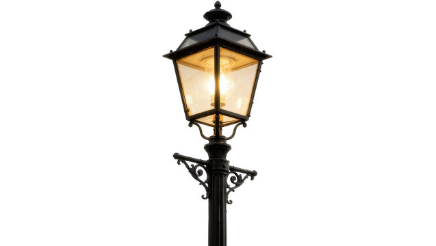 Ornate black metal street lamp with glowing bulb, isolated on transparent background
