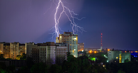 Lightning and a stormy sky over the city at night © Андрій Данилюк