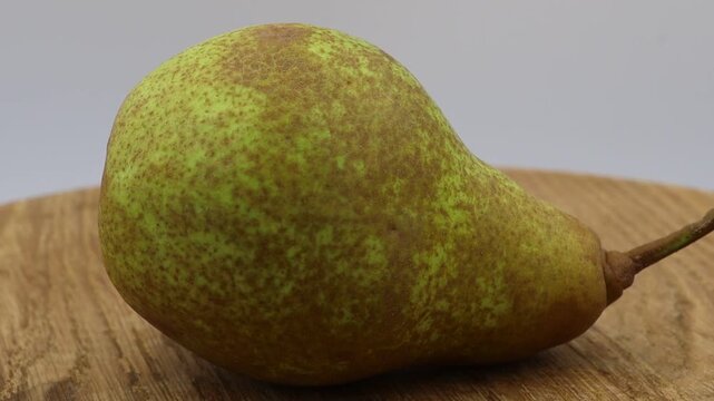 Rotating pear in slow motion.